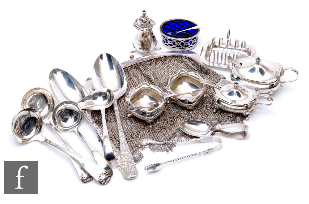 A parcel lot of assorted hallmarked silver items to include flat ware, a cruet, a miniature toast