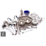 A parcel lot of assorted hallmarked silver items to include flat ware, a cruet, a miniature toast