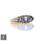 An 18ct sapphire and diamond seven stone ring in the Edwardian style, weight 5.6g, ring size O.