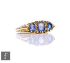 An 18ct sapphire and diamond seven stone ring in the Edwardian style, weight 5.6g, ring size O.