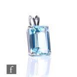 A 9ct hallmarked white gold single stone aquamarine pendant, weight 11.5ct, claw set to below a