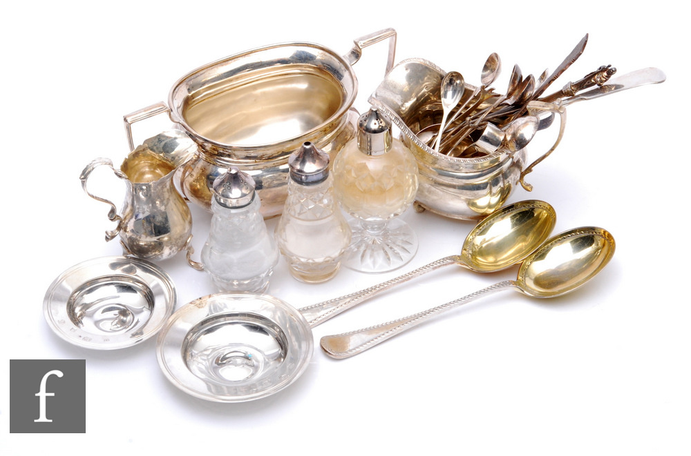 A parcel lot of assorted hallmarked silver items to include a cream and a sugar basin, various