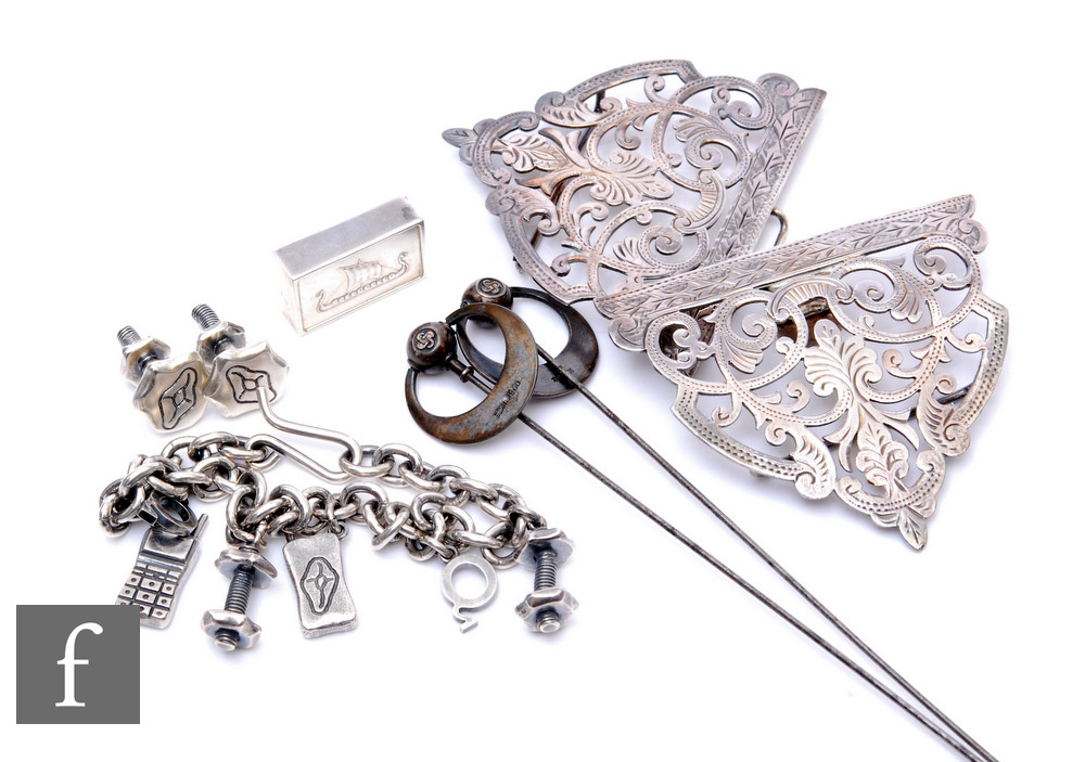 A small parcel lot of assorted silver items, a nurse's buckle, a pair of continental silver Arts &