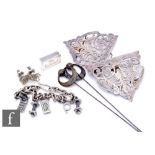 A small parcel lot of assorted silver items, a nurse's buckle, a pair of continental silver Arts &