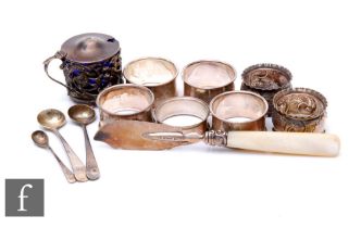 A small parcel lot of assorted hallmarked silver items to include a set of four napkin rings, a