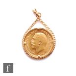 A George V full sovereign dated 1911, claw set to a 9ct pendant mount, total weight 11.3g.