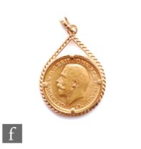 A George V full sovereign dated 1911, claw set to a 9ct pendant mount, total weight 11.3g.
