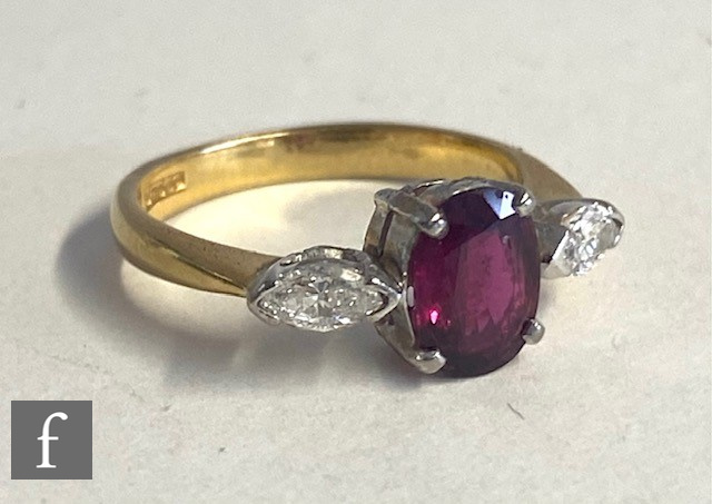 An 18ct hallmarked ruby and diamond three stone ring, central oval ruby, length 7mm, flanked by a - Image 2 of 4