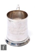 A George III hallmarked small silver tankard of plain form with presentation engraving, weight