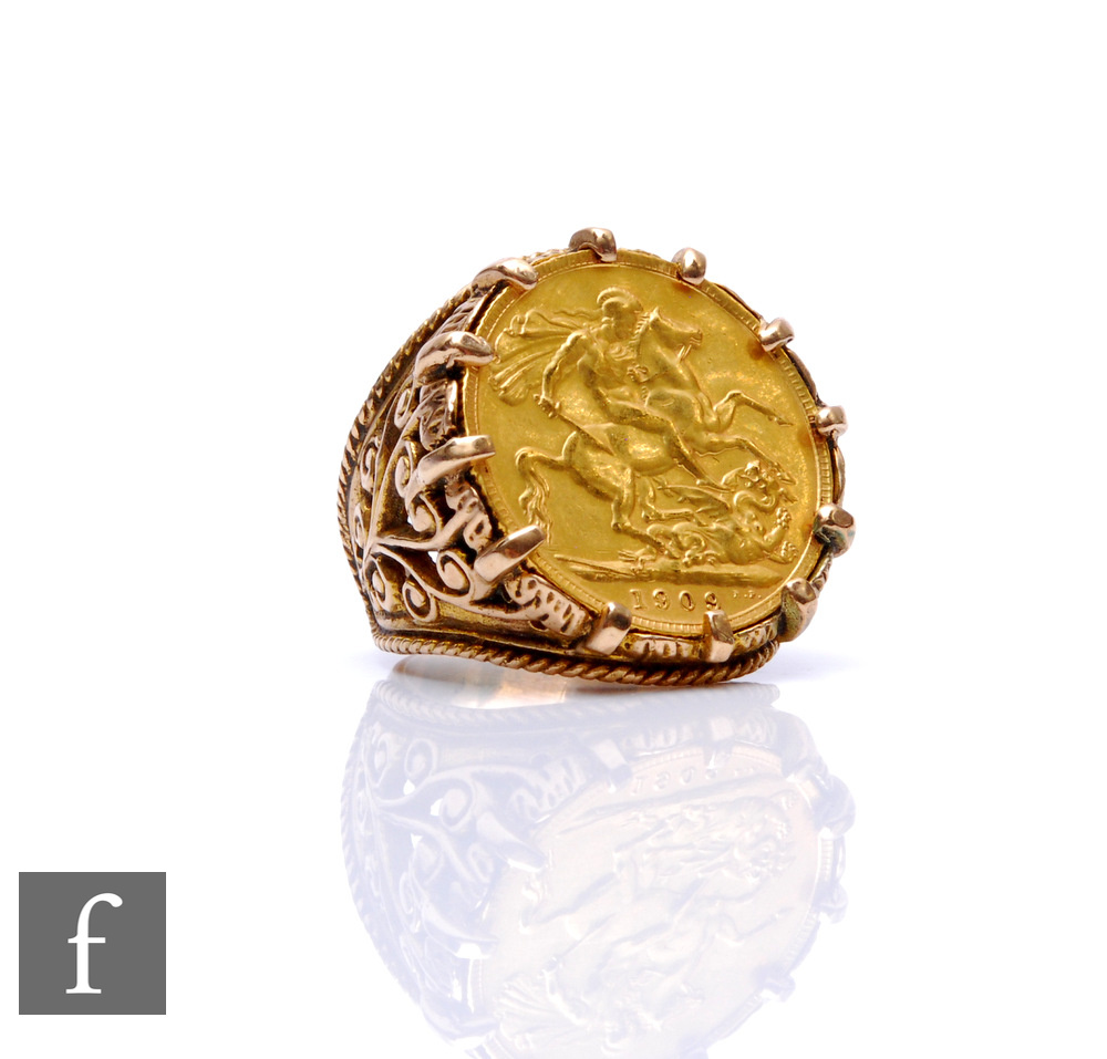 A 9ct hallmarked full sovereign ring, loose mounted coin dated 1909, to a pierced shank, total