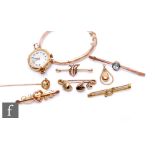 A parcel lot of assorted 9ct jewellery to include a bangle, five bar brooches, a stick pin and a