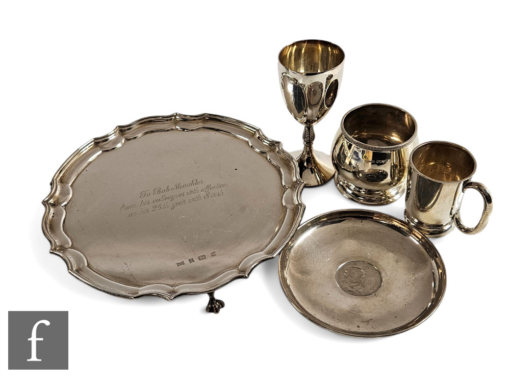 A small parcel lot of hallmarked silver items to include a salver, a small tankard, a dish with
