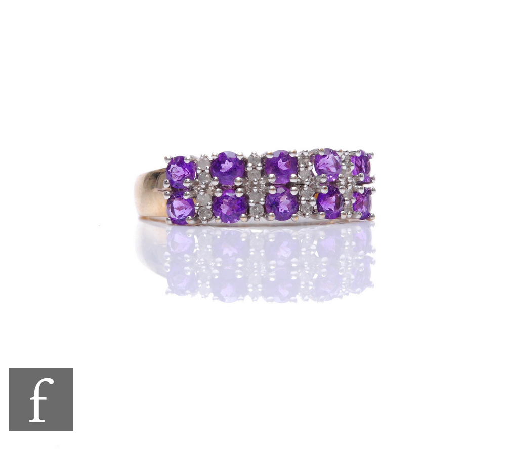 A 9ct hallmarked amethyst and diamond ring, five pairs of vertically set diamonds spaced by