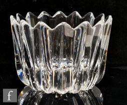 An Orrefors clear glass bowl, of high sided circular form, moulded with vertical triangular