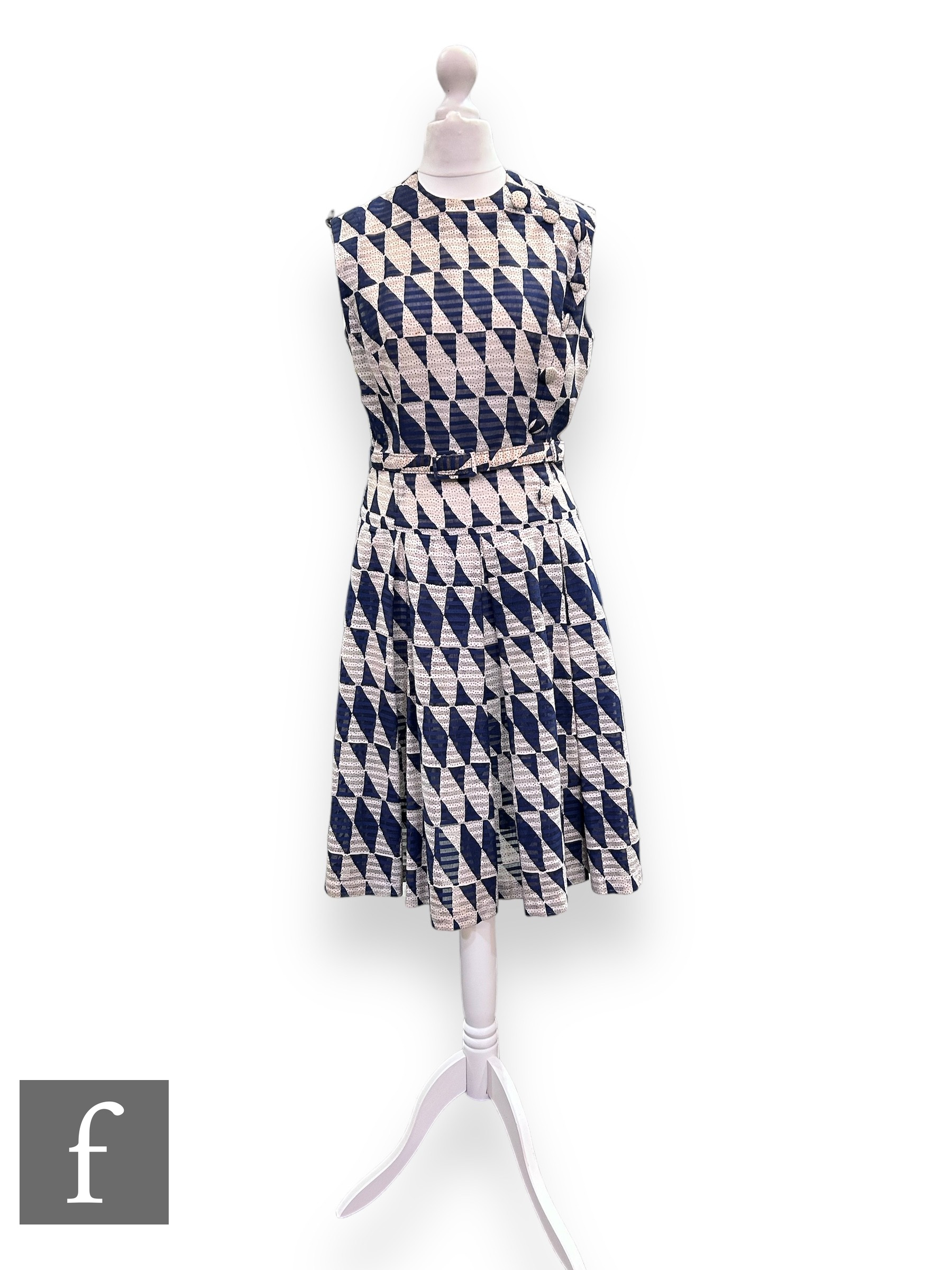 A 1960s vintage sleeveless cotton shift dress, with off centre button detail before a pleated flared