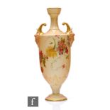 An early 20th Century Royal Worcester porcelain pedestal vase, shape 1759, of footed and