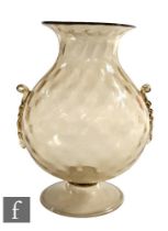 An early 20th Century Italian Murano pale gold glass vase in the manner of Vittorio Zecchin for