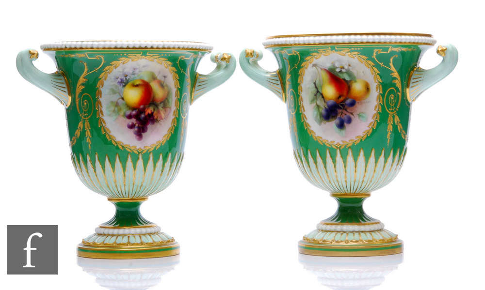 A matched pair of Richard Seabright Royal Worcester porcelain urns, dated 1906, pattern number 2157,