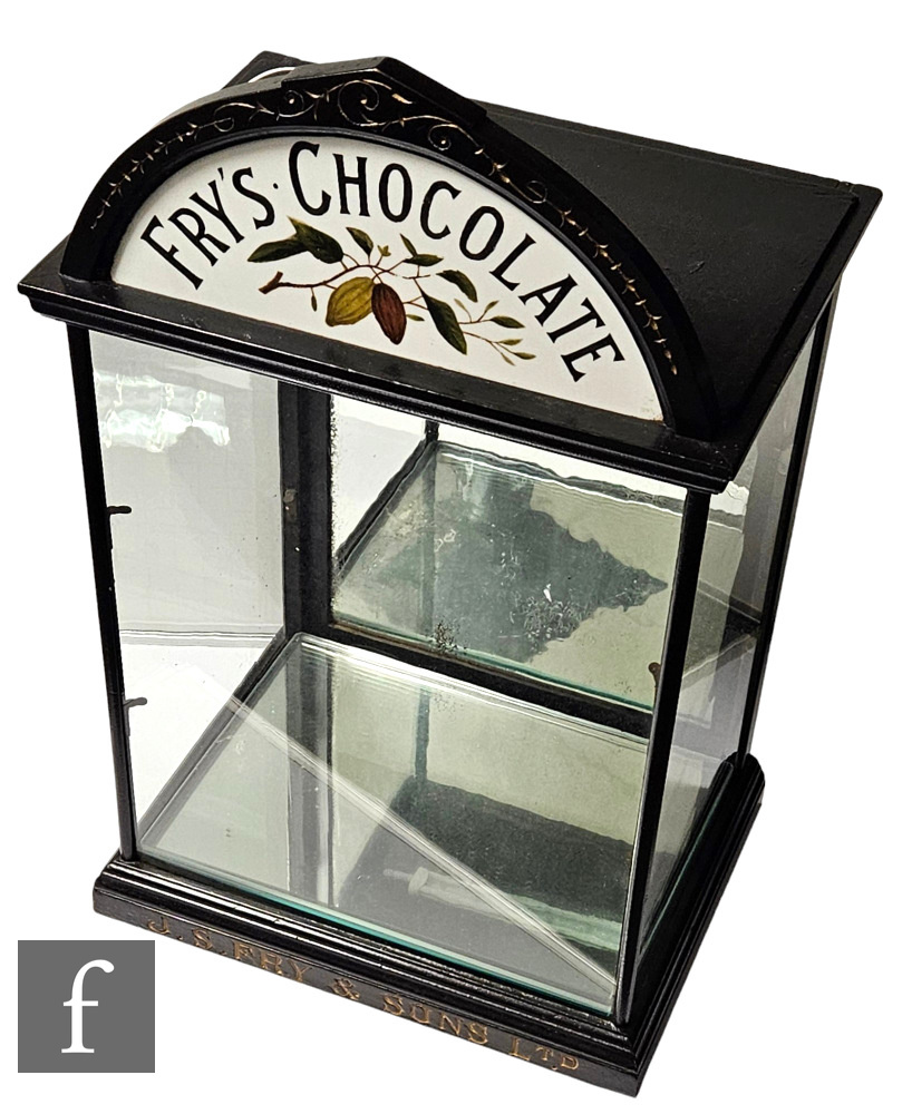 A late 19th Century Fry's Chocolate table top ebonised display cabinet, painted arch with opaque