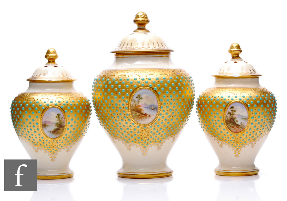 A garniture of Coalport porcelain 'Scottish Loch' pot pourri jars and covers, circa 1900, all with a