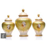 A garniture of Coalport porcelain 'Scottish Loch' pot pourri jars and covers, circa 1900, all with a