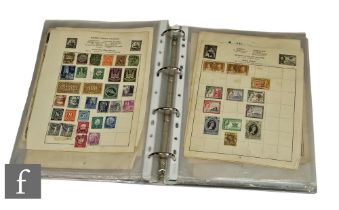 An early 20th Century stamp album containing countries of the world, also Commonwealth, definitive