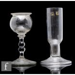 An early 19th Century clear crystal glass oil lamp  of spherical form with a double inverted