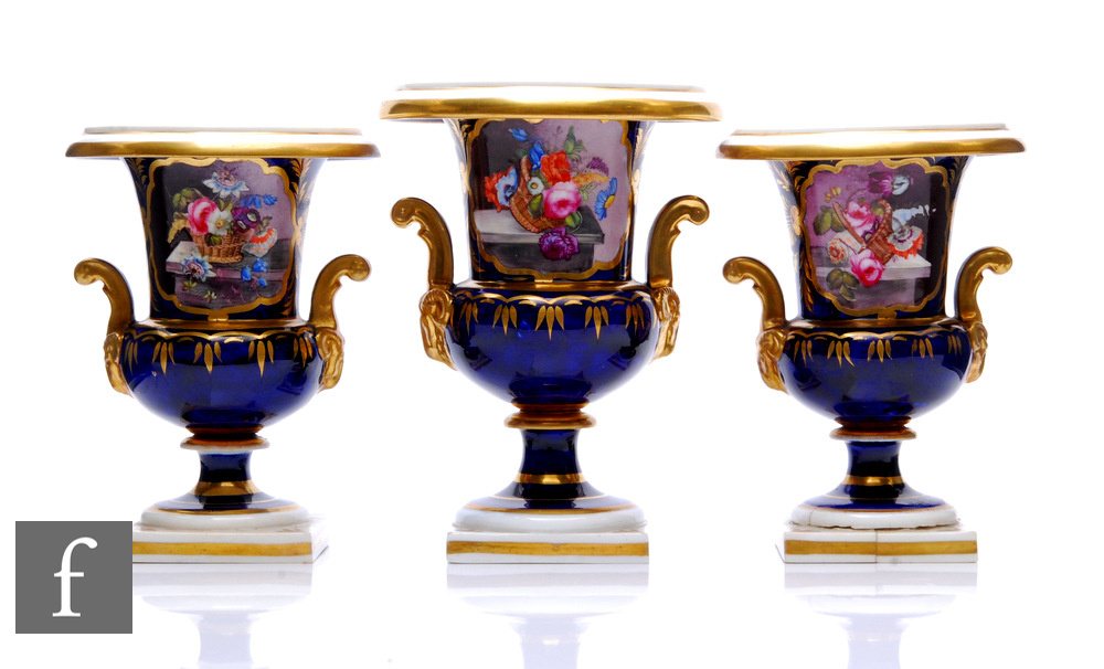 A garniture of Derby porcelain urns, circa 1820, each of campana form, raised on a square section