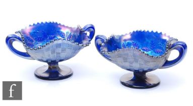 A pair of early 20th Century Carnival glass bon bon dishes with twin handles and wave edged rims, by