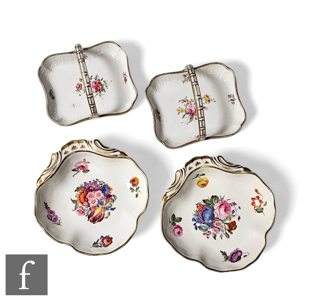A pair of early 19th Century Derby shell shaped dishes, painted with floral sprays to the field,