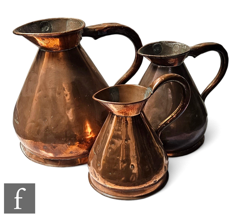 A collection of three 19th Century Farrow & Jackson, London, graduated copper haystack measures,