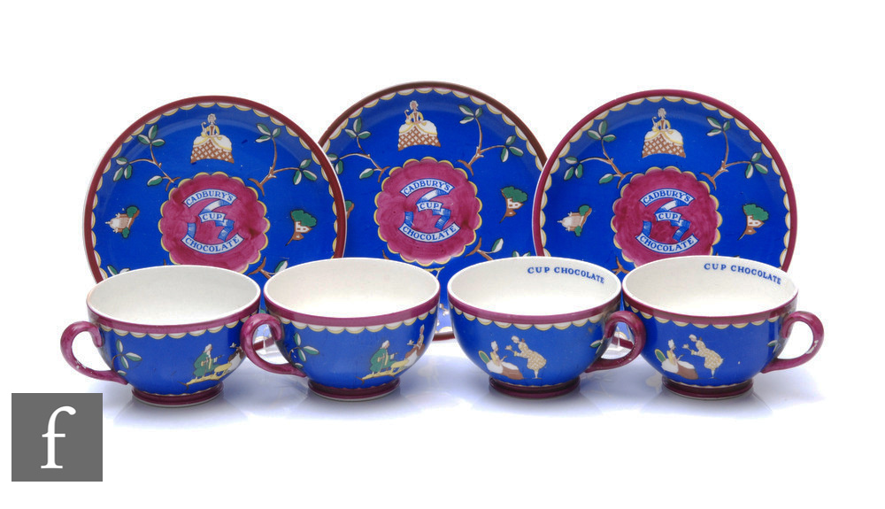 A set of 1920s Wedgwood Cadbury's chocolate advertising cups and saucers, each decorated with blue