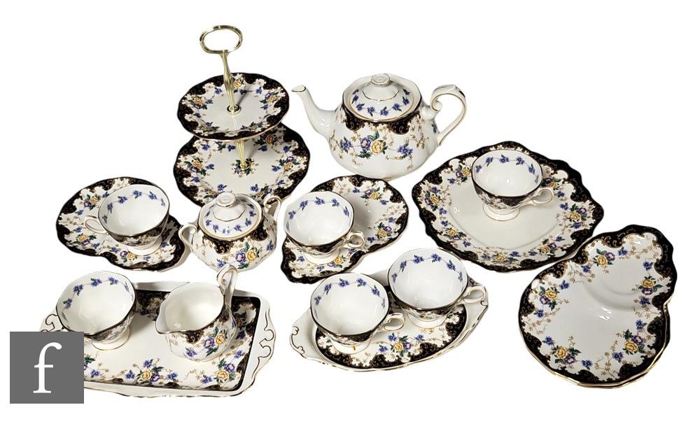 A contemporary Royal Albert commemorative tea service for their 100th Anniversary, comprising a