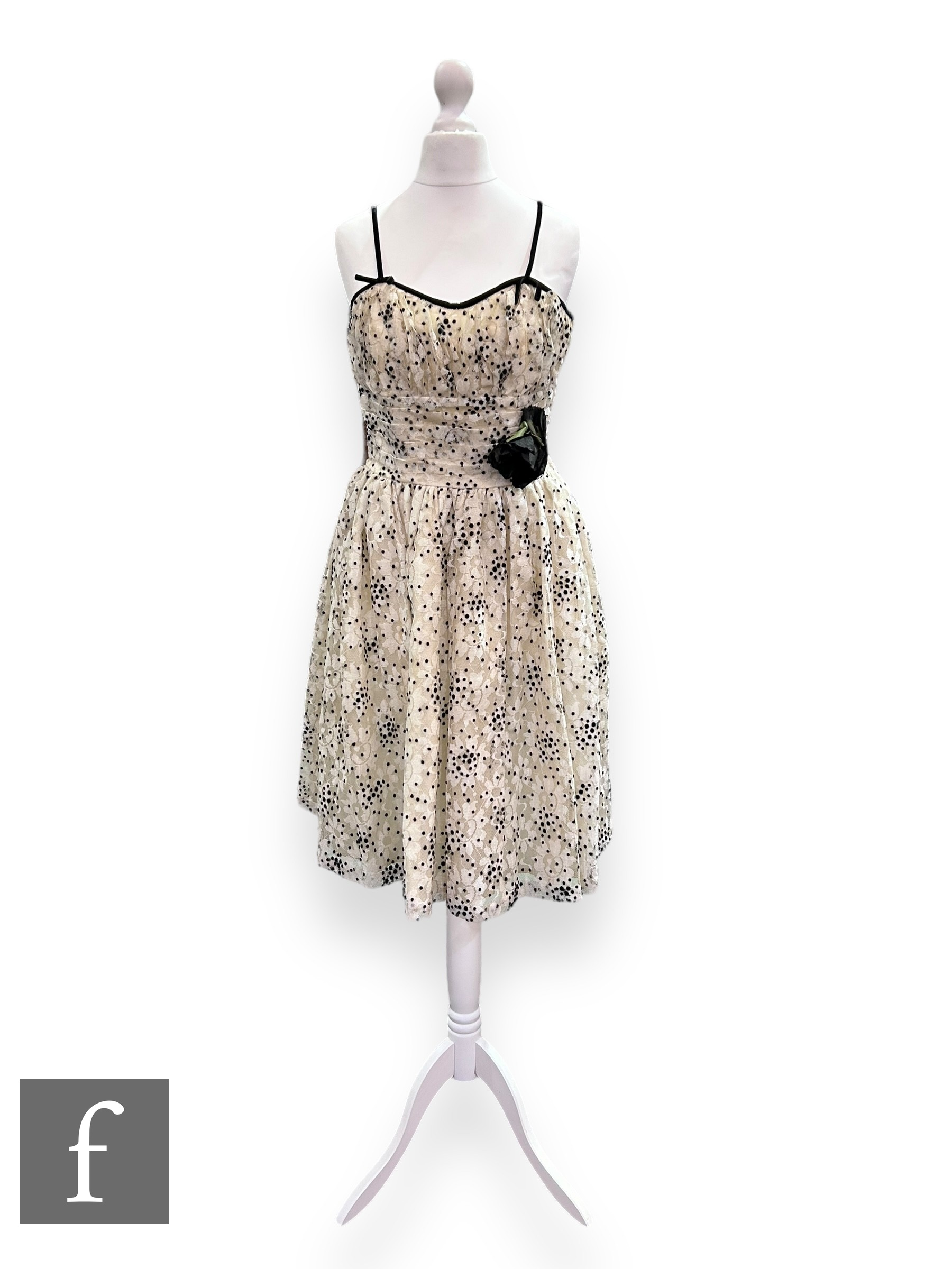 A 1950s/60s vintage evening dress, the ruched and pleated bodice with thin black straps before a