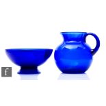 A large Bristol Blue water jug of ovoid form with everted collar neck and hollow loop handle, height