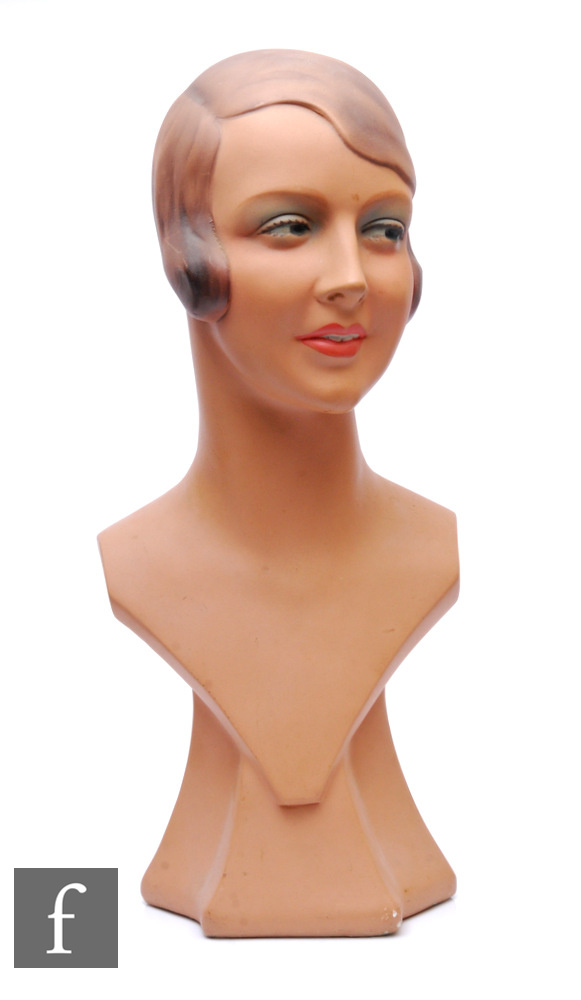 A 1930s shop display mannequin head, the painted plaster figure, modelled as a smiling young