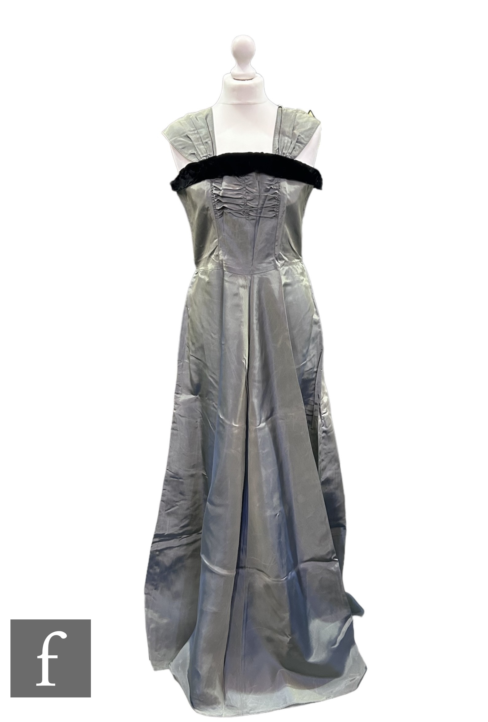 A 1950s vintage evening dress, the square neckline before a long flared maxi skirt all in grey