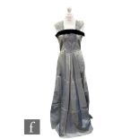 A 1950s vintage evening dress, the square neckline before a long flared maxi skirt all in grey