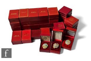 A collection of thirty nine various boxed Halcyon Day enamel boxes, mainly year and Christmas boxes.