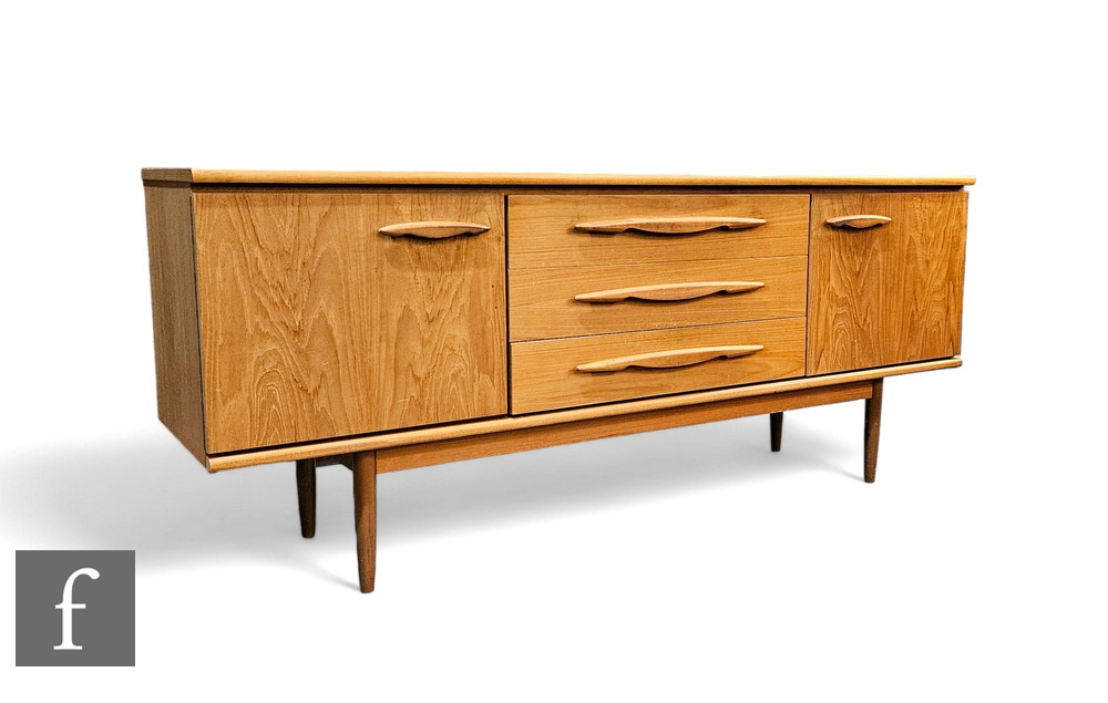 A mid Century Jentique teak sideboard, the plank top above the central three drawers, and flanked by