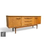A mid Century Jentique teak sideboard, the plank top above the central three drawers, and flanked by