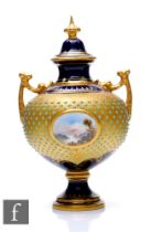 A Coalport porcelain pedestal vase and cover, circa 1900, with upright arched handles, and spreading