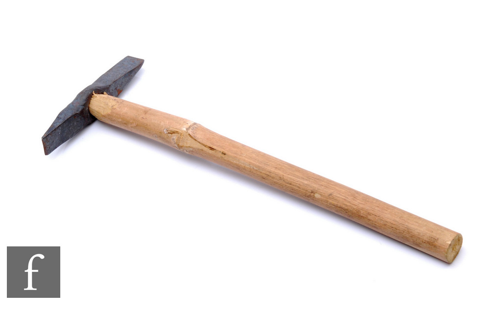 A geologist's rock hammer, spike and chisel double end, later wood handle, length 39cm.