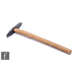 A geologist's rock hammer, spike and chisel double end, later wood handle, length 39cm.