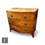 A mahogany George III bow front chest of drawers, the plank top over three long drawers, with