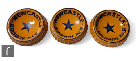 Three pottery advertising bottle top ashtrays for Newcastle Brown Ale, maker Henry W King & Co