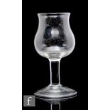 A large 18th Century goblet circa 1740, the tulip bowl with everted rim above a large solid plain