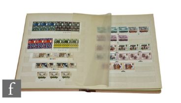 An Elizabeth II stock book containing unmounted mint commemorative stamp sets including some pre-