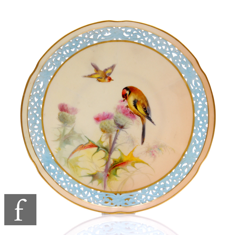 A 19th Century Worcester Grainger reticulated cabinet plate, painted to the field with a bird
