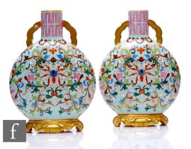 A pair of late 19th Century Worcester moonflasks, each of flattened circular from, the upright